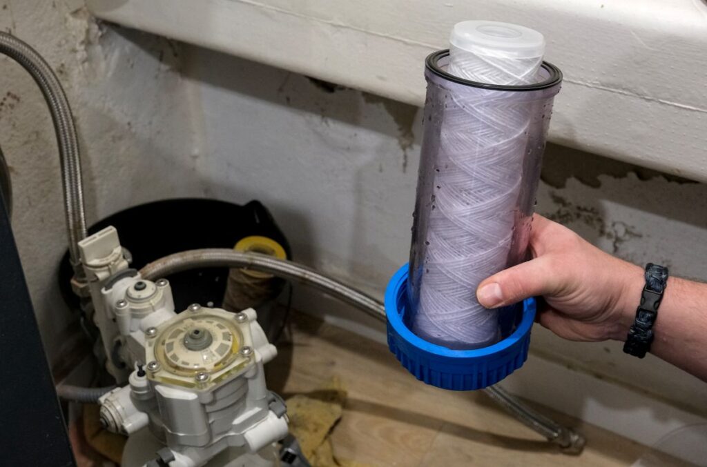 man holding water filter