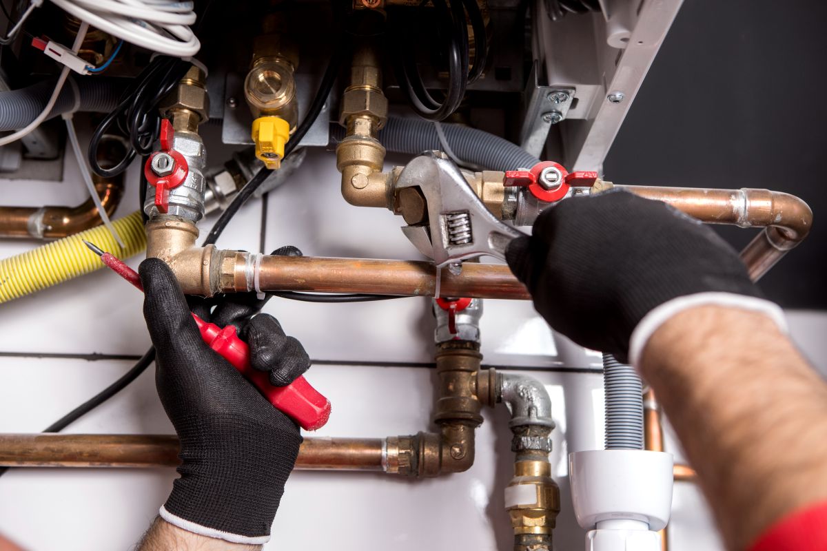 plumber using black gloves